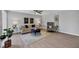 Bright living room with updated flooring, neutral decor, and stylish furniture at 804 Montrose Dr # 103, Venice, FL 34293