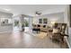 Bright living room with an open floor plan and luxury vinyl plank flooring at 804 Montrose Dr # 103, Venice, FL 34293