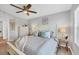 Spacious bedroom with luxury vinyl plank flooring, a ceiling fan and neutral tones at 804 Montrose Dr # 103, Venice, FL 34293
