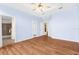 Light and airy main bedroom with hardwood floors and ensuite bathroom access at 8448 Kinglet Dr, Englewood, FL 34224