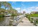 Wooden boat dock with lift, providing convenient waterfront access at 93 Inlets Blvd # 93, Nokomis, FL 34275