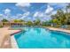 Inviting community swimming pool with clear blue water for residents' leisure at 93 Inlets Blvd # 93, Nokomis, FL 34275