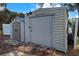 Large storage shed with a single door, offering extra storage space at 3447 Malinda Ter, North Port, FL 34286