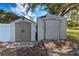 Two storage sheds, one large and one small, providing ample outdoor storage at 3447 Malinda Ter, North Port, FL 34286