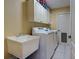 Laundry room with utility sink, washer, and dryer at 3447 Malinda Ter, North Port, FL 34286