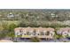 Aerial view of condo building with covered parking at 8315 Glenrose Way # 1414, Sarasota, FL 34238