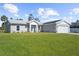 Newly built home with a spacious yard and attached garage at 4347 Alametos Ave, North Port, FL 34288