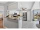 Updated kitchen with granite countertops, stainless steel appliances, and view to backyard at 804 Montrose Dr # 103, Venice, FL 34293