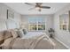 Spacious bedroom with large window, ceiling fan and neutral decor at 804 Montrose Dr # 103, Venice, FL 34293