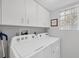 Laundry room with Whirlpool washer and dryer at 804 Montrose Dr # 103, Venice, FL 34293