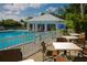 Community pool with adjacent seating area at 804 Montrose Dr # 103, Venice, FL 34293