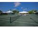 Well-maintained tennis court with surrounding landscaping at 804 Montrose Dr # 103, Venice, FL 34293