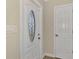 Front entry with white door and adjacent closet at 4646 Fallon Cir, Port Charlotte, FL 33948