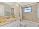 Bathroom with granite countertop and bathtub shower combo at 4646 Fallon Cir, Port Charlotte, FL 33948