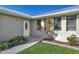Well-maintained house exterior with a white front door and landscaping at 4646 Fallon Cir, Port Charlotte, FL 33948