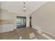 Kitchen with white cabinets, granite countertops and view to dining area at 4646 Fallon Cir, Port Charlotte, FL 33948