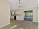 White kitchen cabinets, granite countertops, and access to screened patio at 4646 Fallon Cir, Port Charlotte, FL 33948