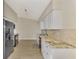 Modern kitchen featuring stainless steel appliances and granite counters at 4646 Fallon Cir, Port Charlotte, FL 33948