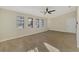 Sunlit living room featuring tile floors and a ceiling fan at 4646 Fallon Cir, Port Charlotte, FL 33948