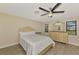 Guest bedroom with ceiling fan and neutral decor at 4646 Fallon Cir, Port Charlotte, FL 33948