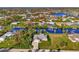 House on a canal with lush green surroundings and neighboring homes at 4646 Fallon Cir, Port Charlotte, FL 33948
