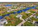 Bird's-eye view of waterfront property and surrounding community at 4646 Fallon Cir, Port Charlotte, FL 33948