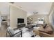 Living room with staged furniture and large TV at 4646 Fallon Cir, Port Charlotte, FL 33948