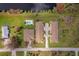 Overhead view of property, pool, and surrounding landscape at 345 Boundary Blvd # C, Rotonda West, FL 33947