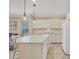 Modern kitchen with white cabinets, a large island, and stainless steel appliances at 1222 Collier Pl, Venice, FL 34293