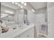 Double vanity bathroom with walk-in shower and tiled flooring at 1222 Collier Pl, Venice, FL 34293
