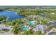 Aerial view of community pool, clubhouse and lake at 1222 Collier Pl, Venice, FL 34293