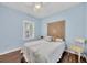 Bedroom with full-size bed and light blue walls at 1222 Collier Pl, Venice, FL 34293
