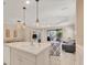 Open kitchen with a large island and views into the living room and dining area at 1222 Collier Pl, Venice, FL 34293