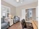 Spacious home office with built-in shelving and hardwood flooring at 1222 Collier Pl, Venice, FL 34293