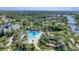 Community pool with a slide and surrounding landscape at 1222 Collier Pl, Venice, FL 34293