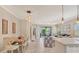 Bright kitchen features white cabinetry and an island at 1222 Collier Pl, Venice, FL 34293