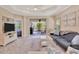 Spacious living area with access to the lanai at 1222 Collier Pl, Venice, FL 34293