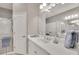 Double vanity bathroom with a walk-in shower and tiled flooring at 1222 Collier Pl, Venice, FL 34293