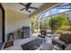 Outdoor kitchen and seating area on a screened patio at 1222 Collier Pl, Venice, FL 34293