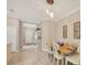 Light and airy dining room with a wooden table and chairs, near the entryway at 1222 Collier Pl, Venice, FL 34293