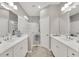 Double vanity bathroom with walk-in shower and tiled flooring at 1222 Collier Pl, Venice, FL 34293