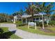 Exterior view of the community's social club, featuring a welcoming design and landscaping at 1222 Collier Pl, Venice, FL 34293