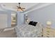 Bright main bedroom with king-size bed and ensuite bathroom access at 11356 Dancing River Dr, Venice, FL 34292