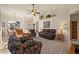 Living room features leather couches and a floral armchair at 4001 Tarpon Rd, Venice, FL 34293