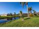 Property backs up to a peaceful canal with lush landscaping at 172 Southampton Pl # 346, Venice, FL 34293