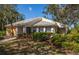 One-story home with landscaped yard and American flag at 172 Southampton Pl # 346, Venice, FL 34293