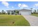 Modern house exterior with paved driveway at 8559 Waldrep St, Port Charlotte, FL 33981