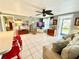 Spacious living room with tile floors and access to the kitchen at 852 E 6Th St, Englewood, FL 34223