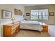 Main bedroom with large window, ample natural light, and carpet flooring at 1704 Triano Cir # 1704, Venice, FL 34292