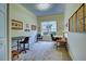 Bright home office features built-in shelving and window seat at 1704 Triano Cir # 1704, Venice, FL 34292